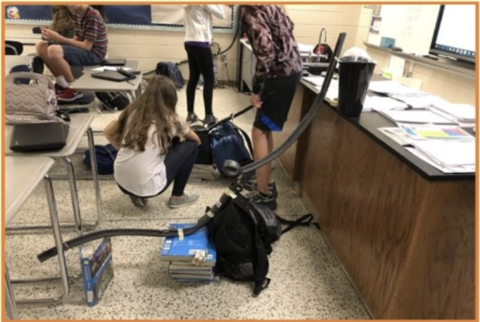 group of students in the middle of an activity in a classroom