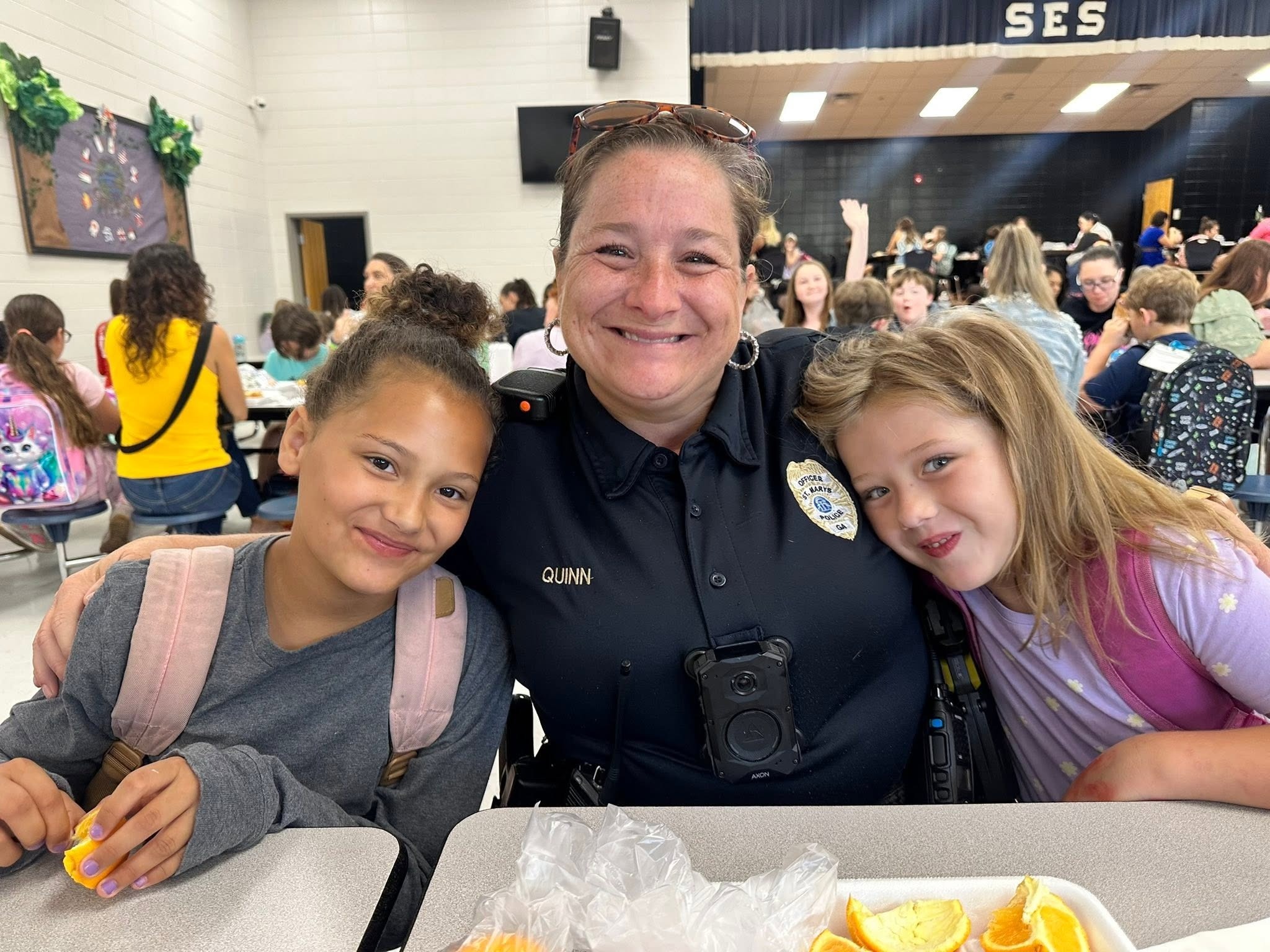 Officer Quinn with two students