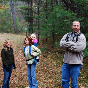 family walking in the forest 