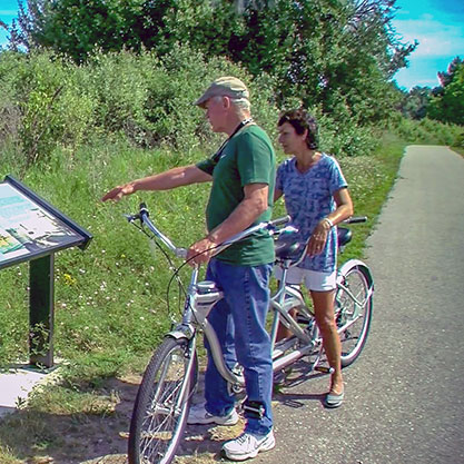 couple in a bike checking a map