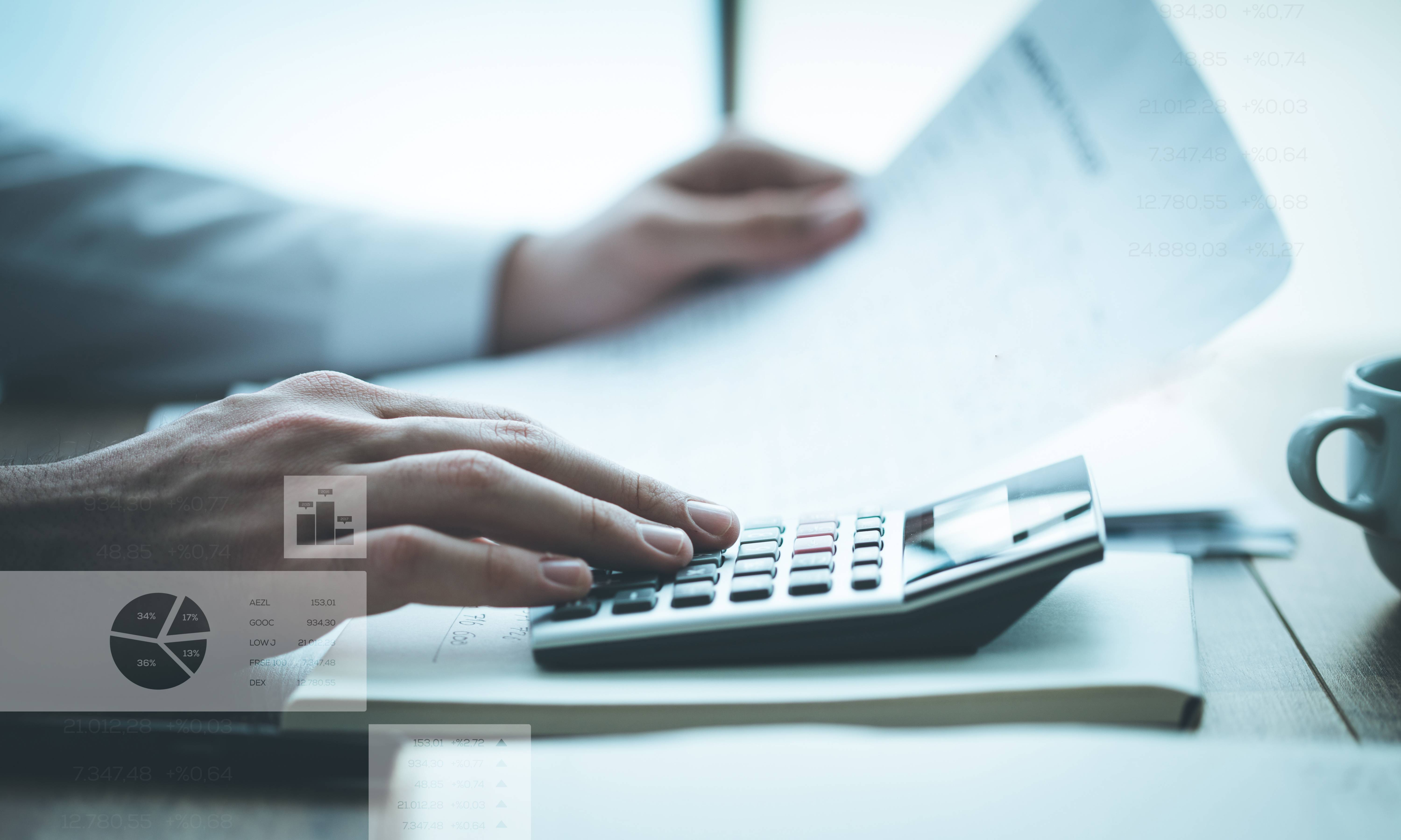 Person working with a paper and calculator