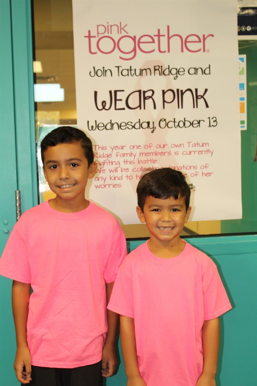 two kids wearing pink