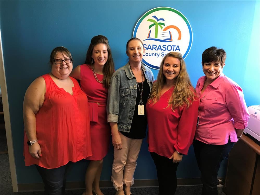 sarasota communication team wearing pink