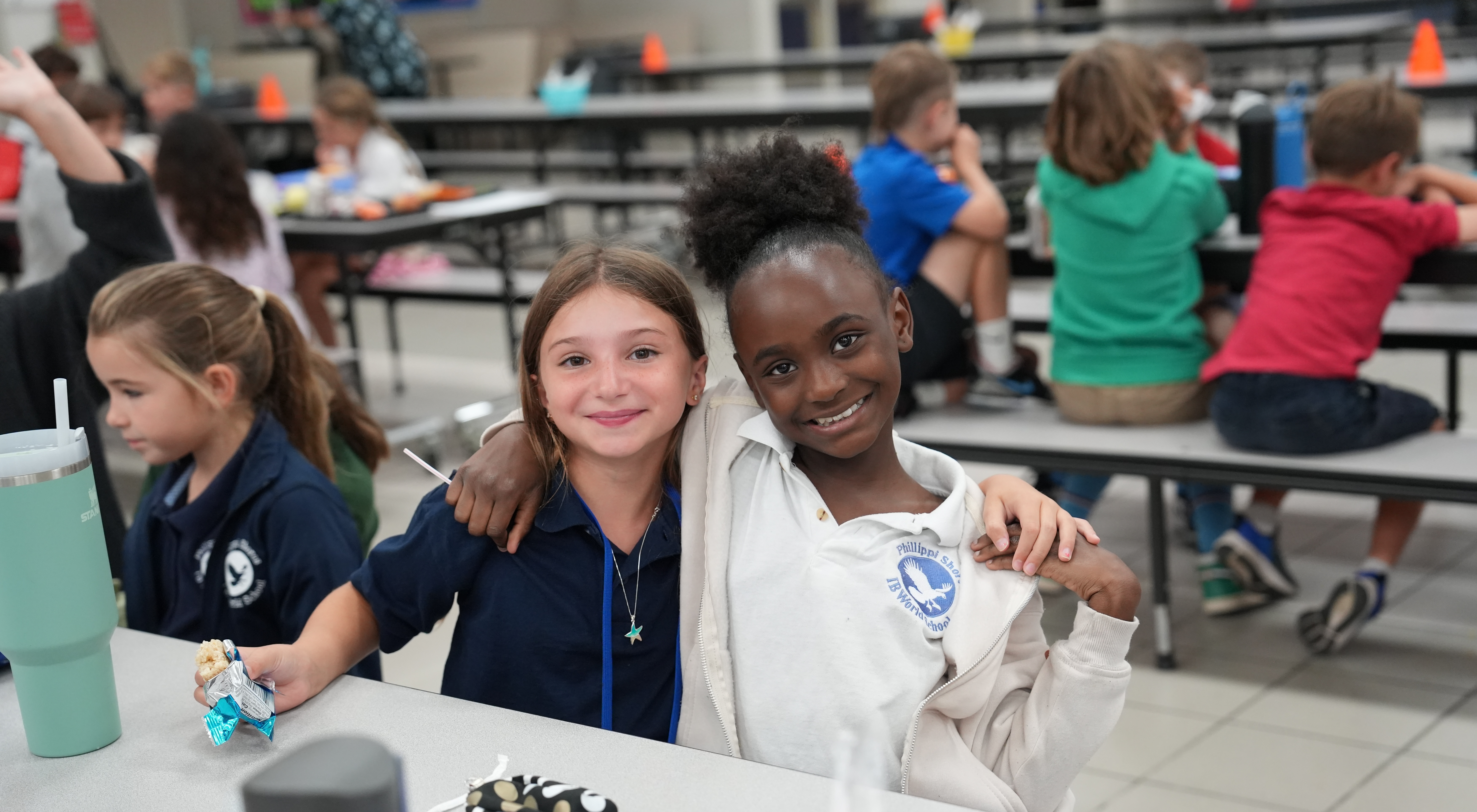 two students smiling at the camera