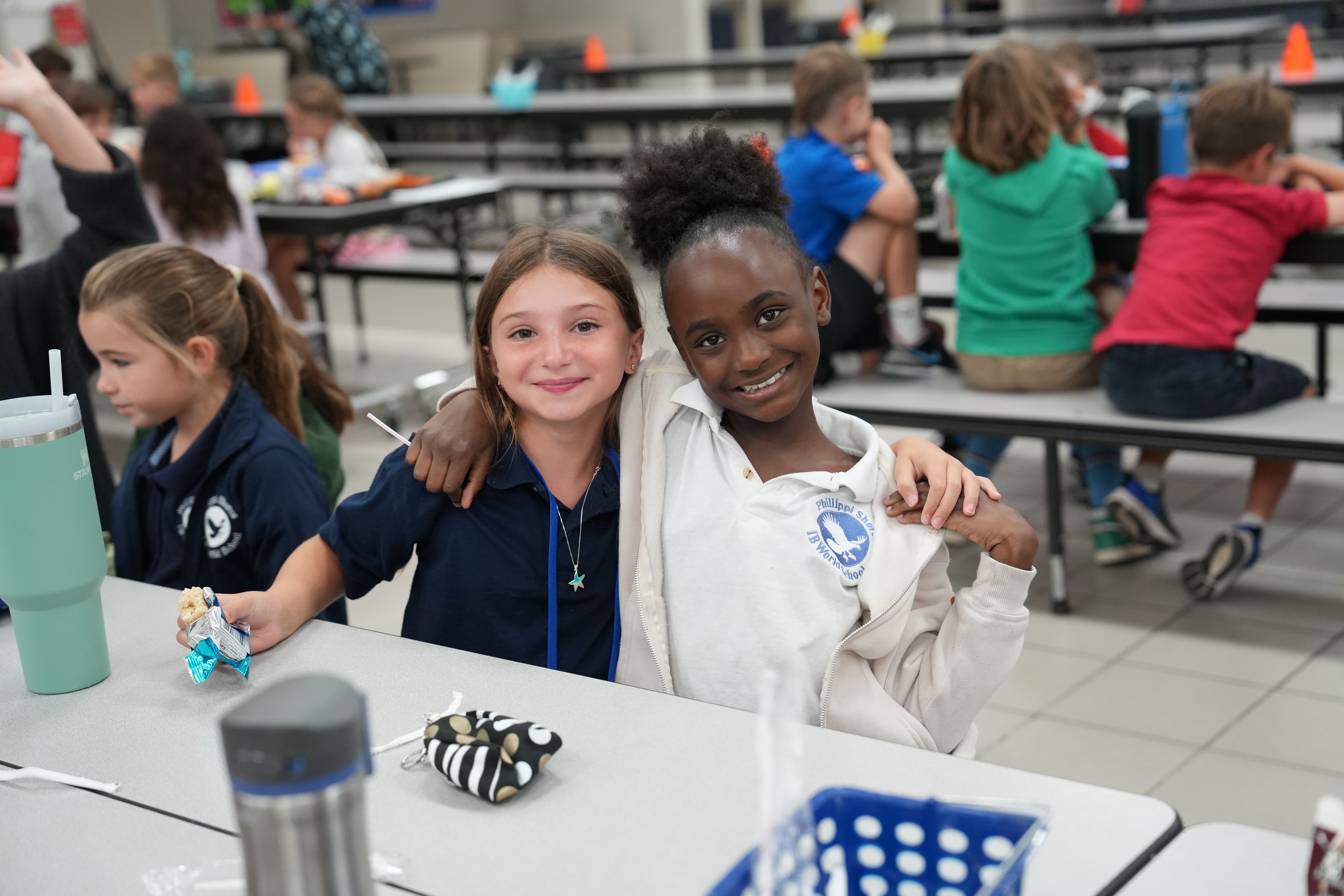 Two Elementary Students Hugging