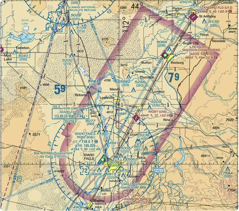 An aviation map with multiple colored lines and numbers indicating routes and altitudes. Background is beige.