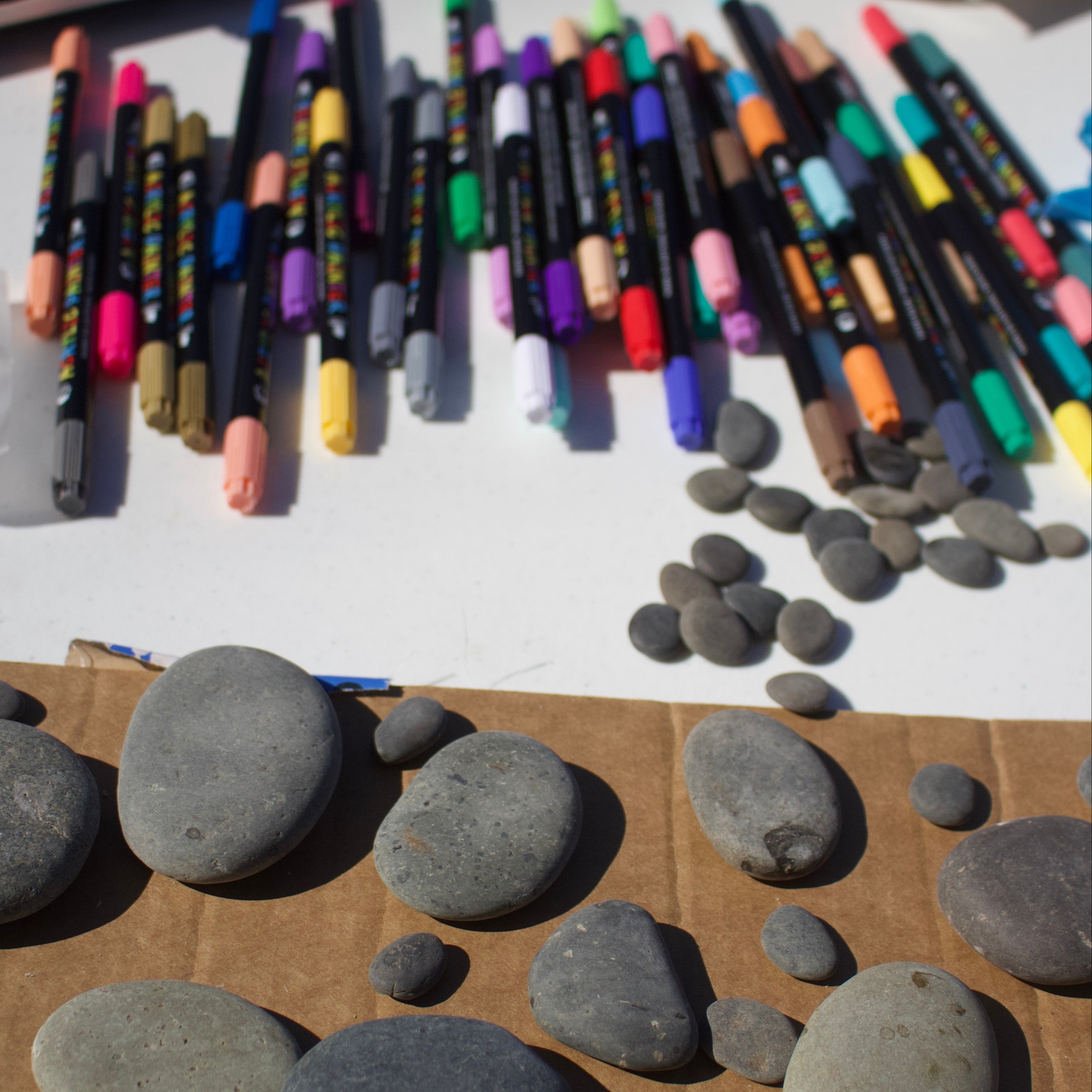 markers and stones on craft table