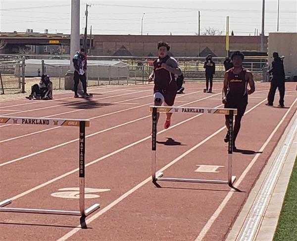 Students running on a obstacle track