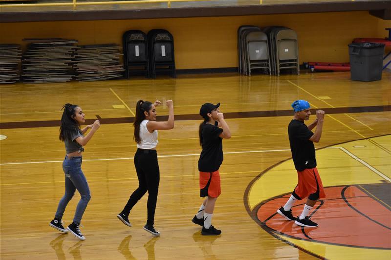 students doing exercise on the basketball court