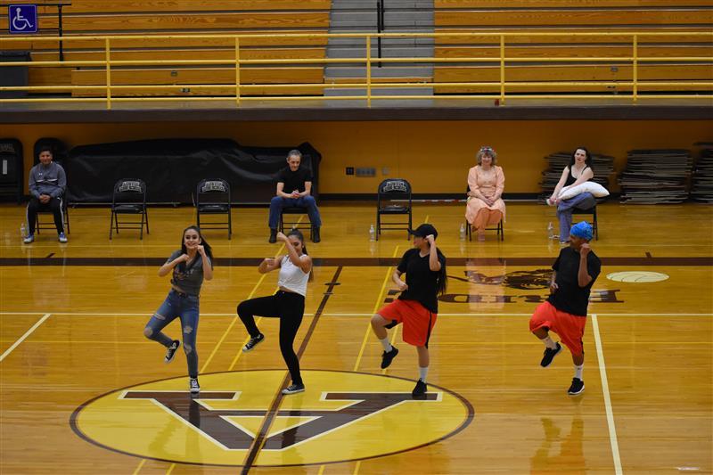students doing exercise on the basketball court