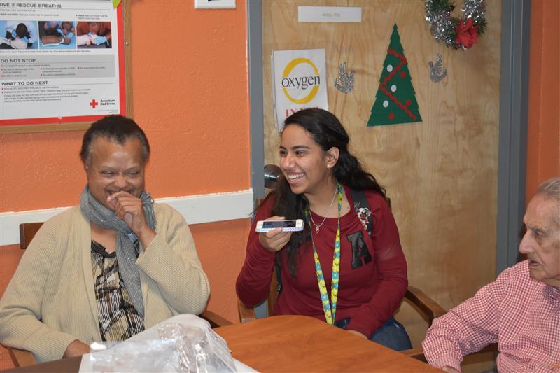 students talking to elderly  people