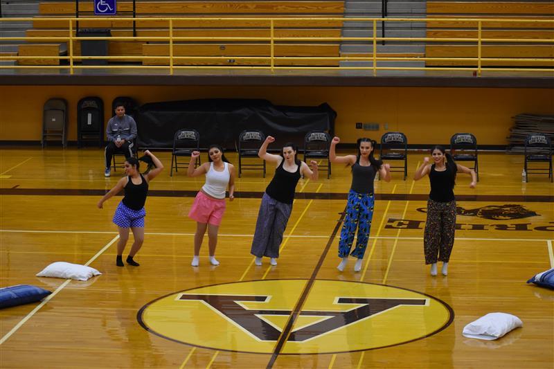 students doing exercise on the basketball court
