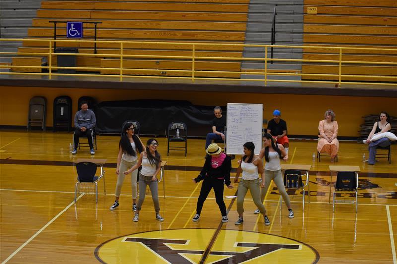 students doing exercise on the basketball court