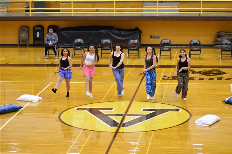 students doing exercise on the basketball court