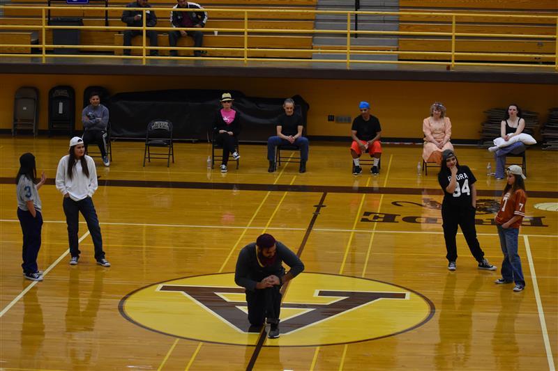 students doing exercise on the basketball court