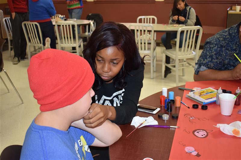 students talking to elderly  people