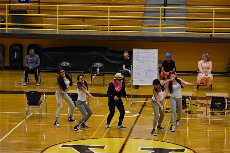 students doing exercise on the basketball court