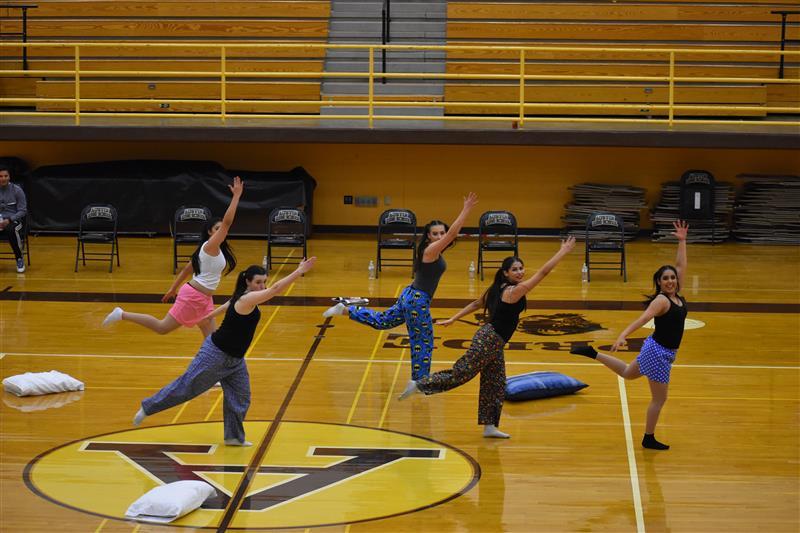 students doing exercise on the basketball court