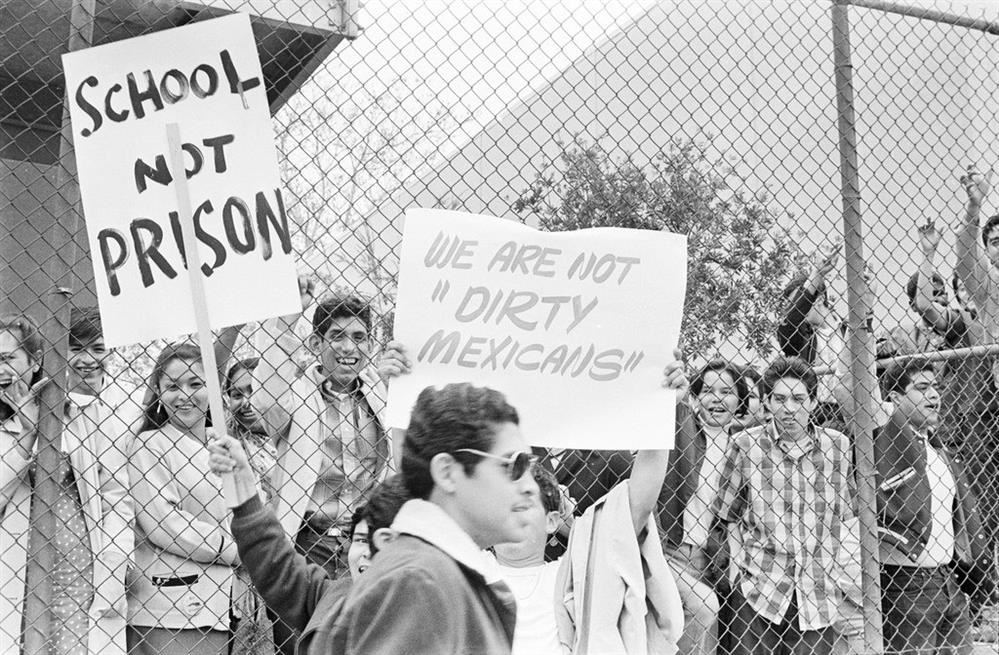 Black and white pictures of a Protest with people holding signs up