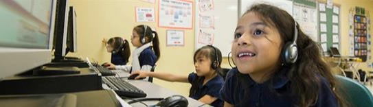 Picture if a girl wearing headphones and looking at a computer screen stating: "The average child between 8 and 18 spends 53 hours a week with media and technology"