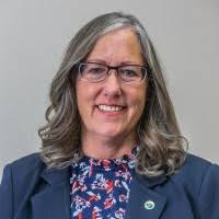 EPCC Dean Terri Mann is seen wearing a blue blazer over a floral shirt, showcasing her professional attire.