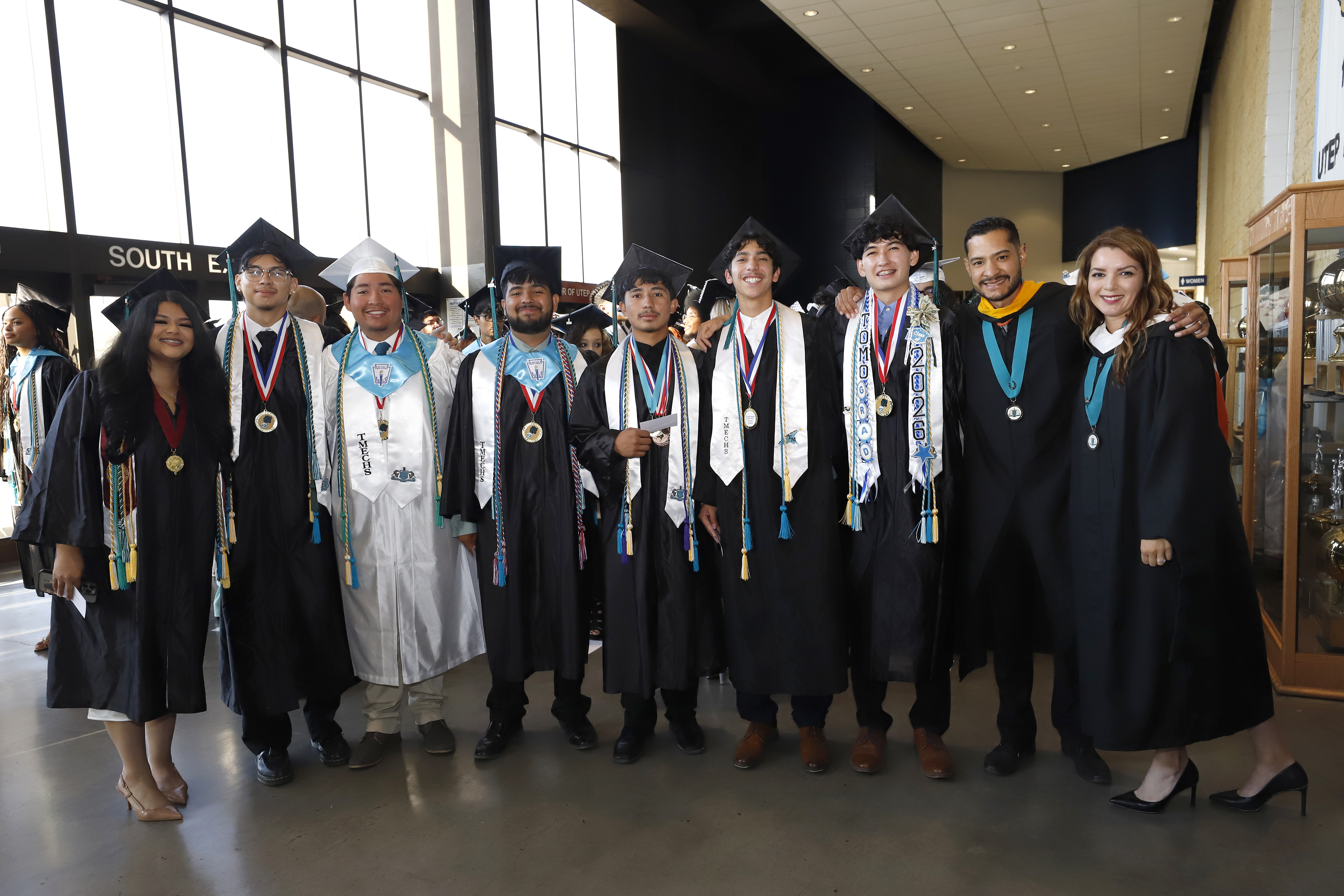 Graduates posting for a picture