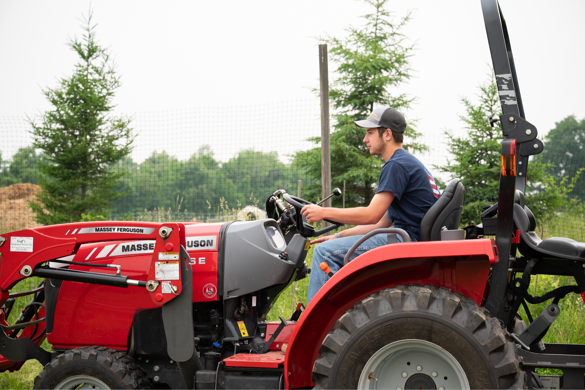 student driving tractor