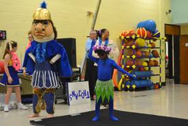 school mascot and students at gym