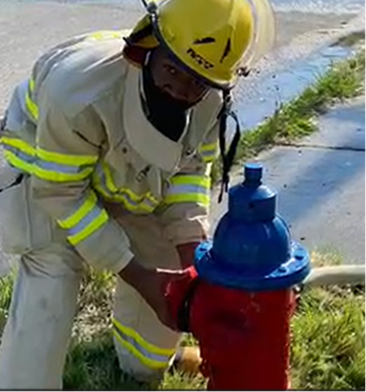 Fire Science student at hydrant