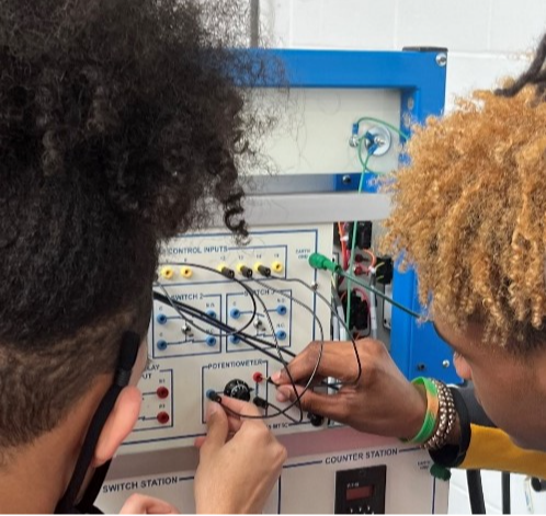 Electromechanical Tech  students working