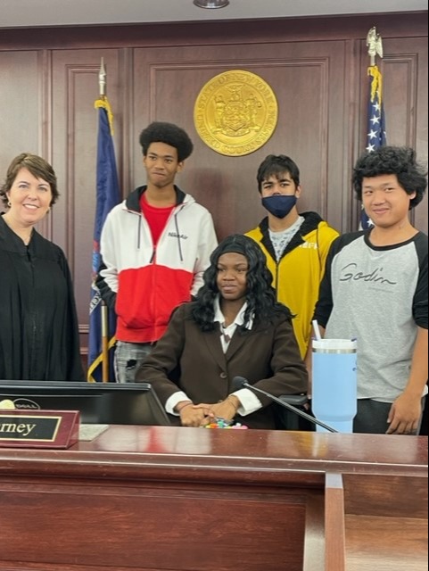 PARALEGAL students pose with judge