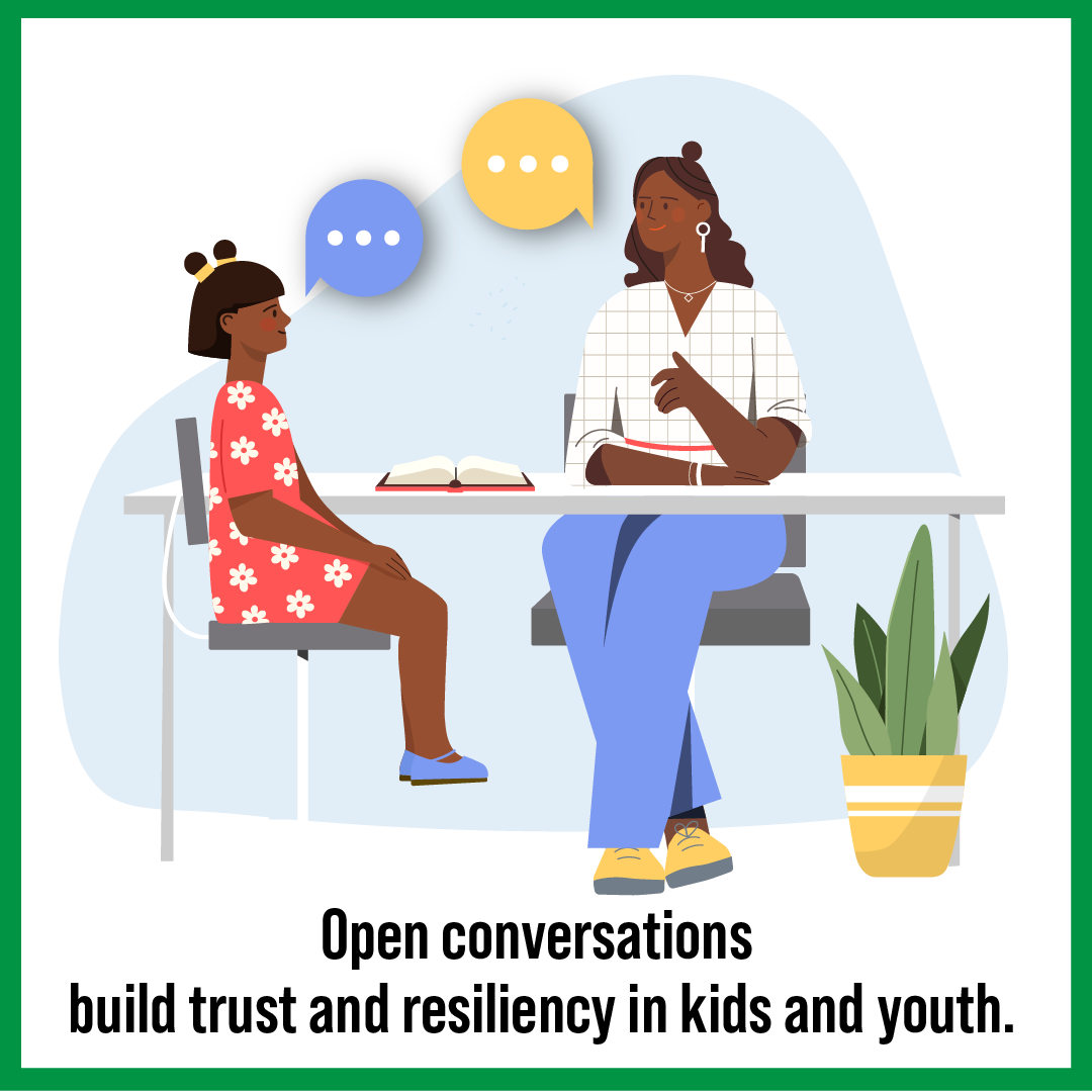 A person sitting at a table talking to a child