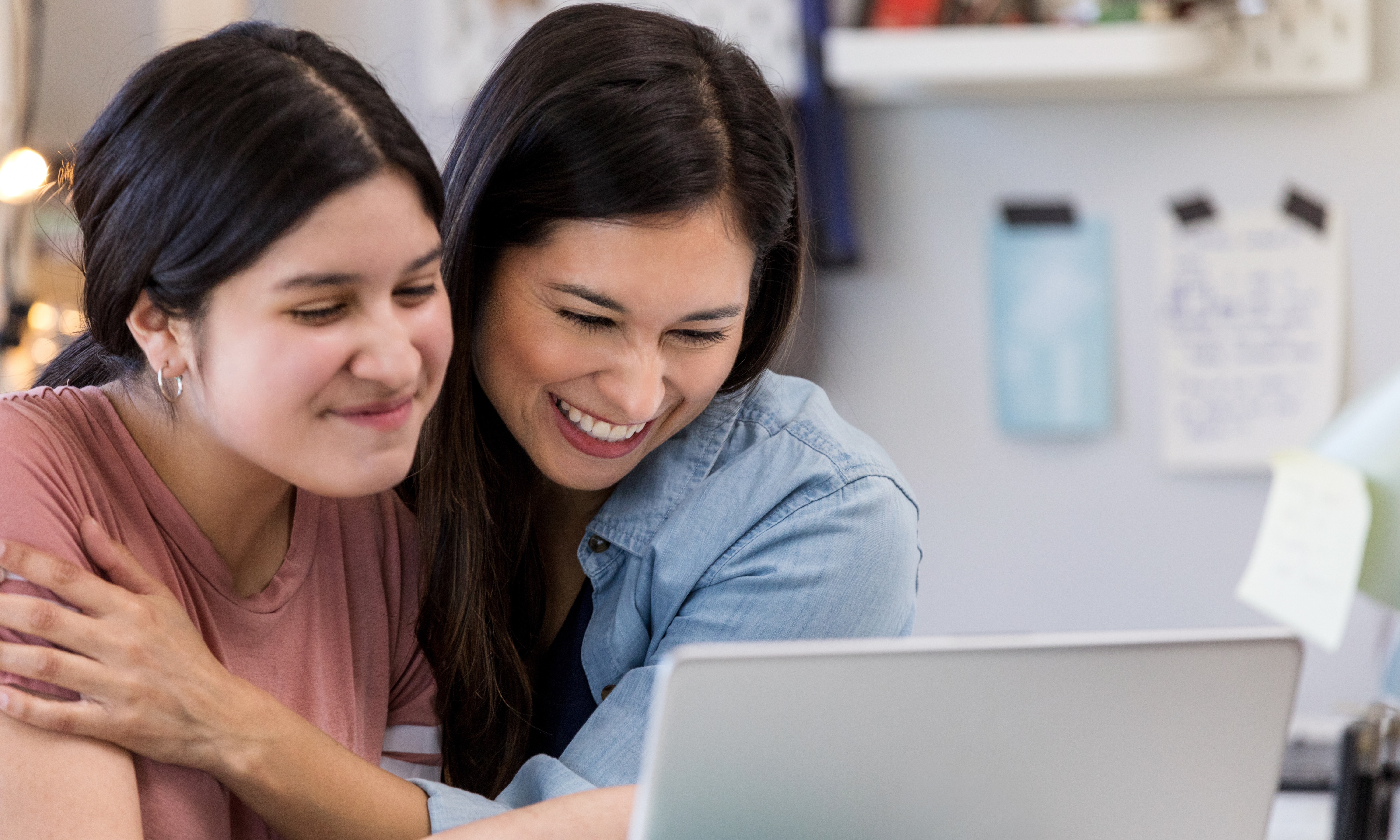 Two girls looking at computer