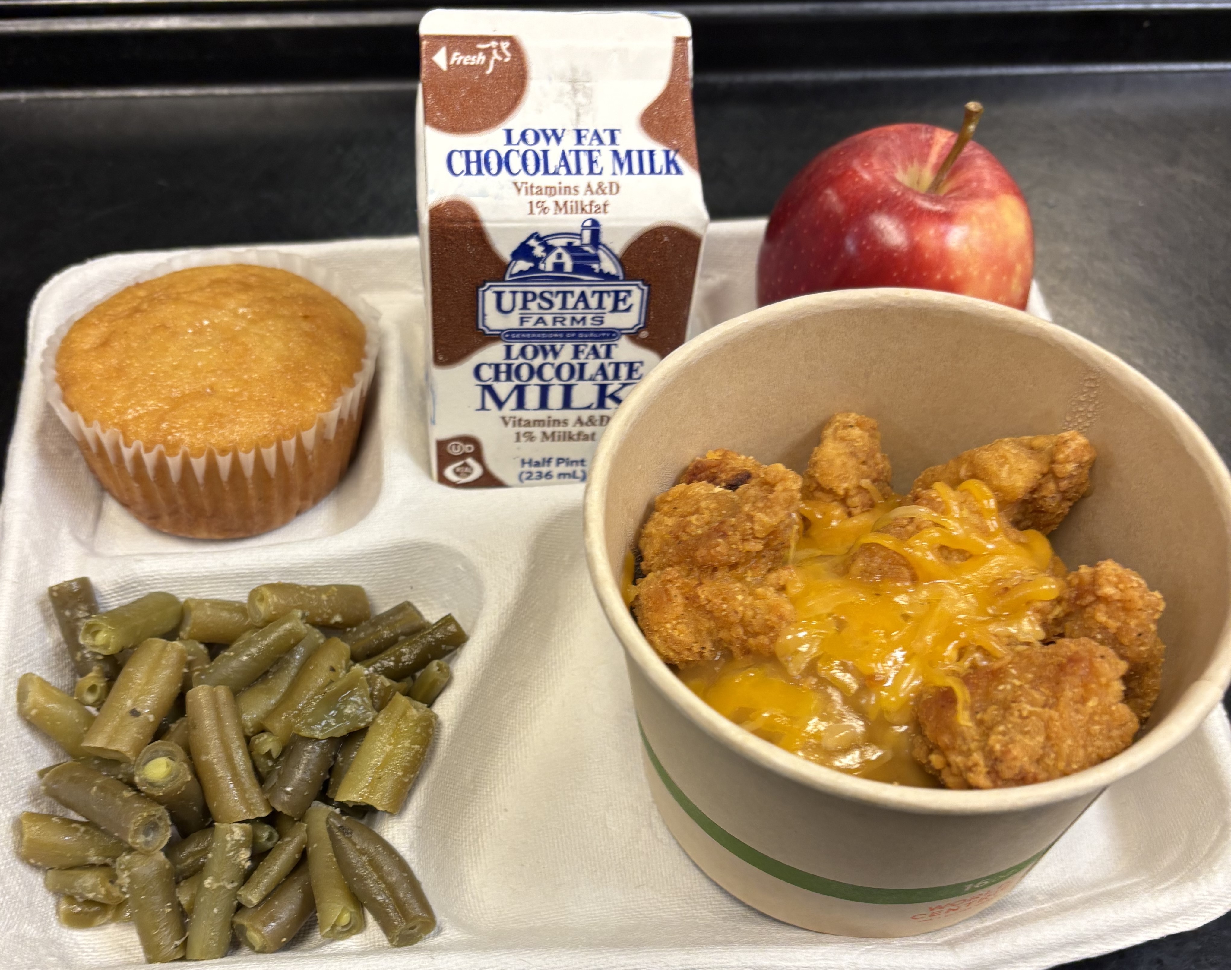  Lunch served on 9.12.2025- Mash Potatoes, Corn, Popcorn Chicken, Green Beans, Corn Muffing, Apple & Milk