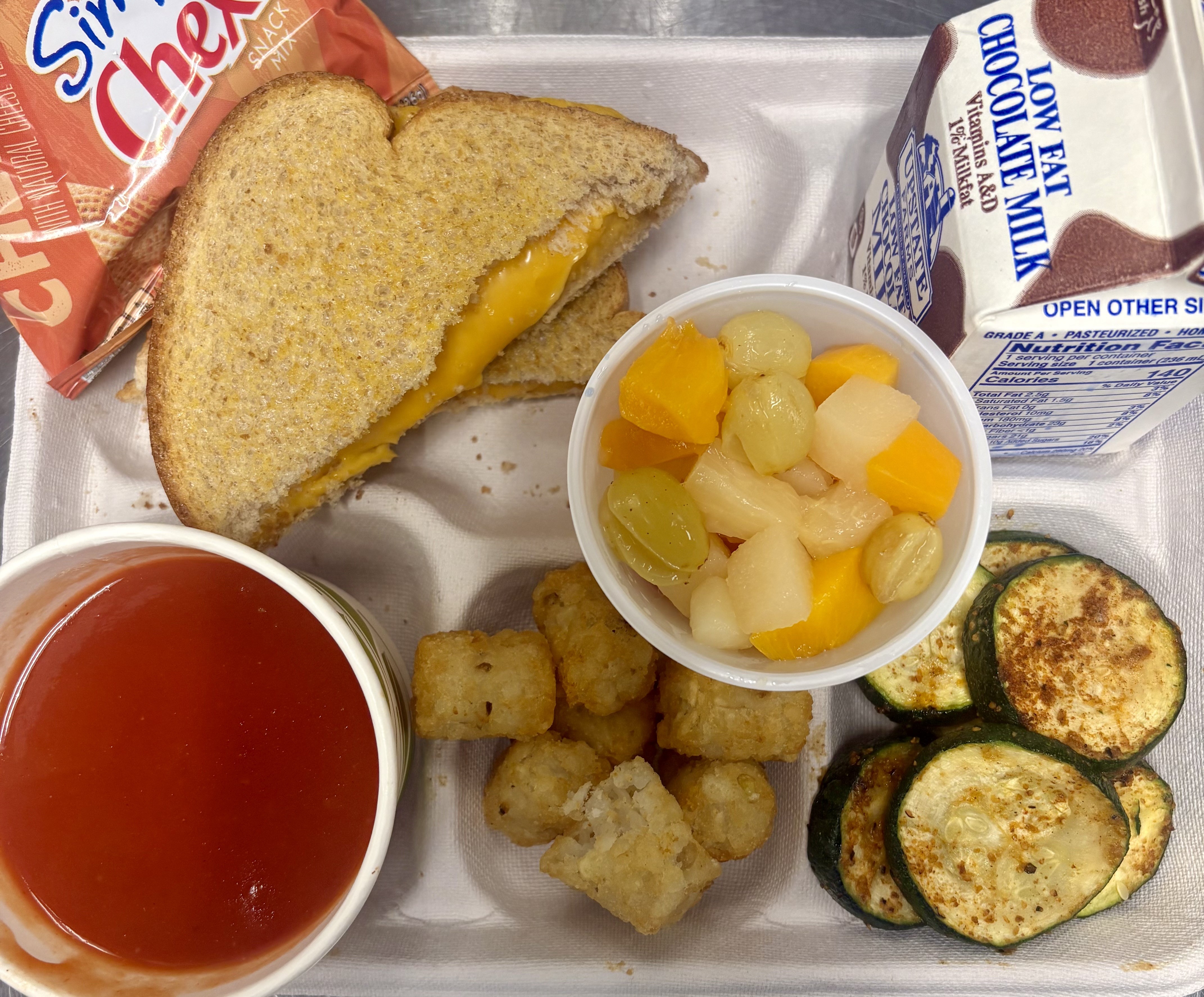 School #9- Lunch served on 9.19.25 Grilled Cheese, Tomato Soup, Tator Tots, NY Roasted Zucchini, Chex & Chocolate Milk