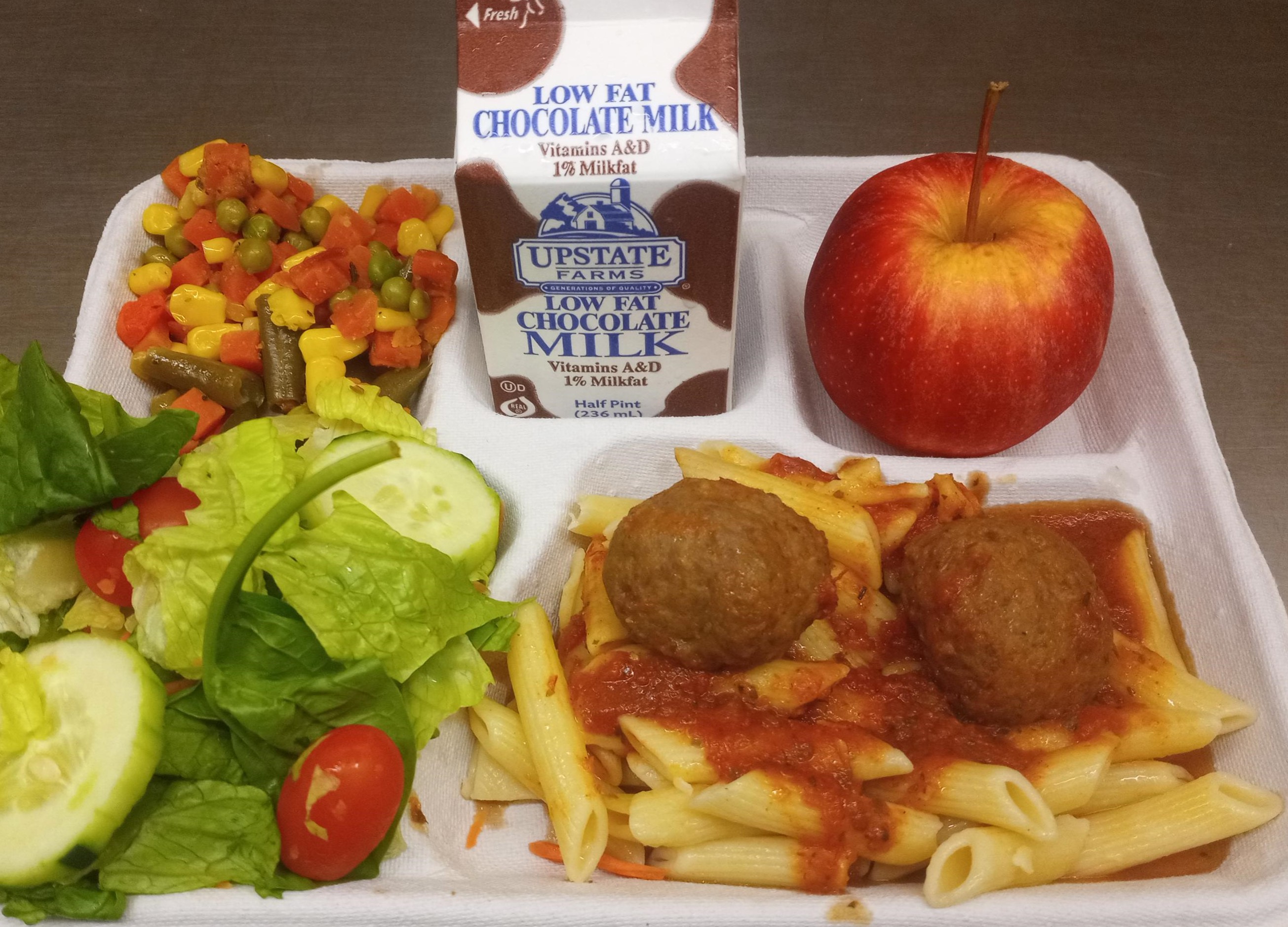 School #10- Lunch served on 9.18.25 NY Beef Meatballs, w Marinara Sauce, WG Penne Pasta, Garden Salad Vegetable Medley, Apple & Chocolate Milk
