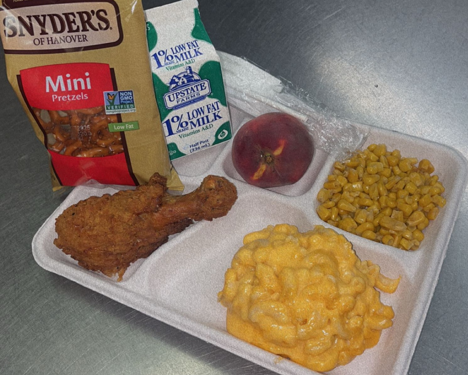 School #12 - Lunch served on 9.17.25 Breaded Chicken Drumstick, Macaroni & Cheese, Pretzels, Sweet Corn, Peach & Milk