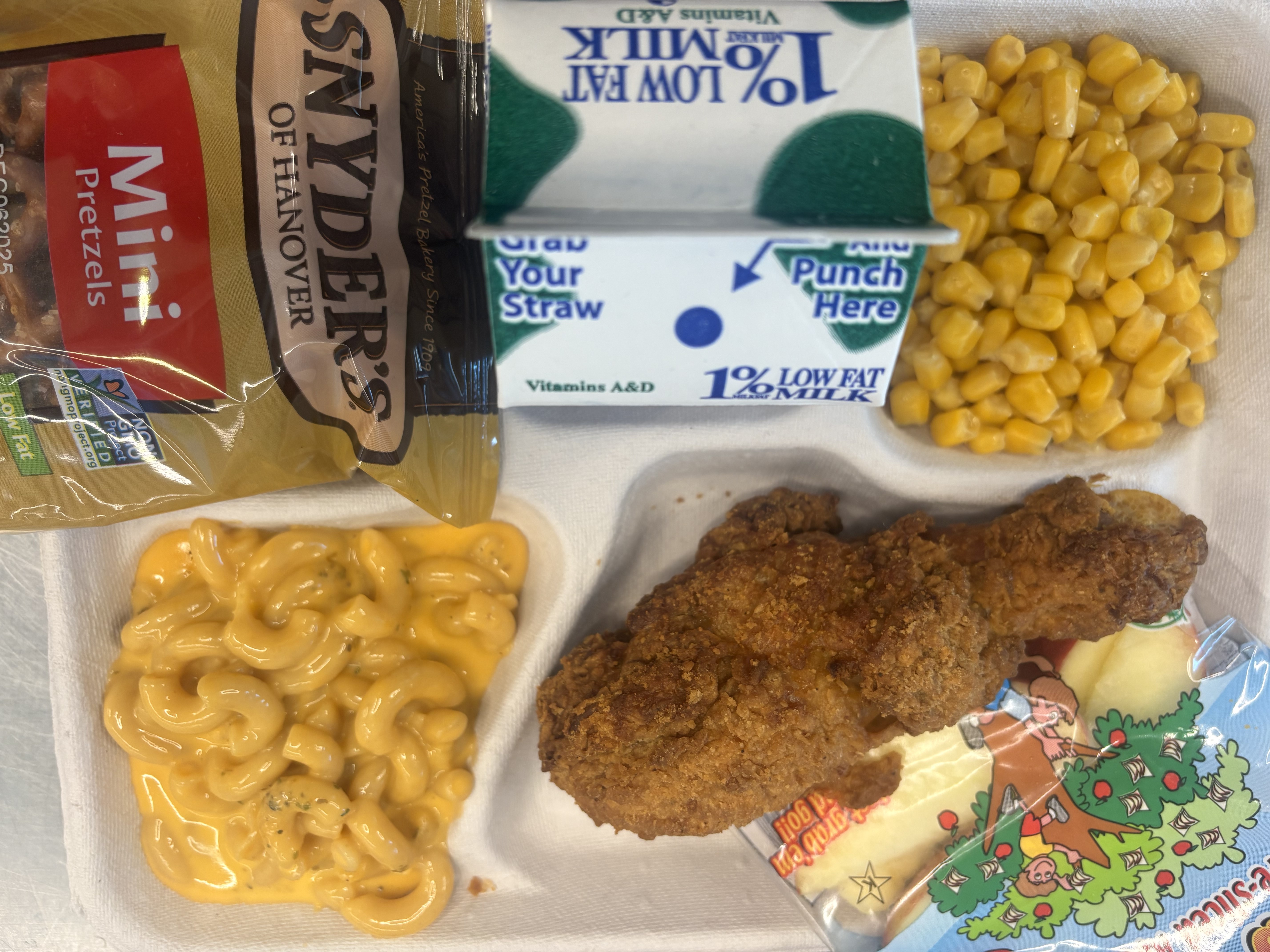 School #17 - Lunch served on 9.17.25 Breaded Chicken Drumstick, Macaroni & Cheese, Pretzels, Sweet Corn, Apple Slices & Milk