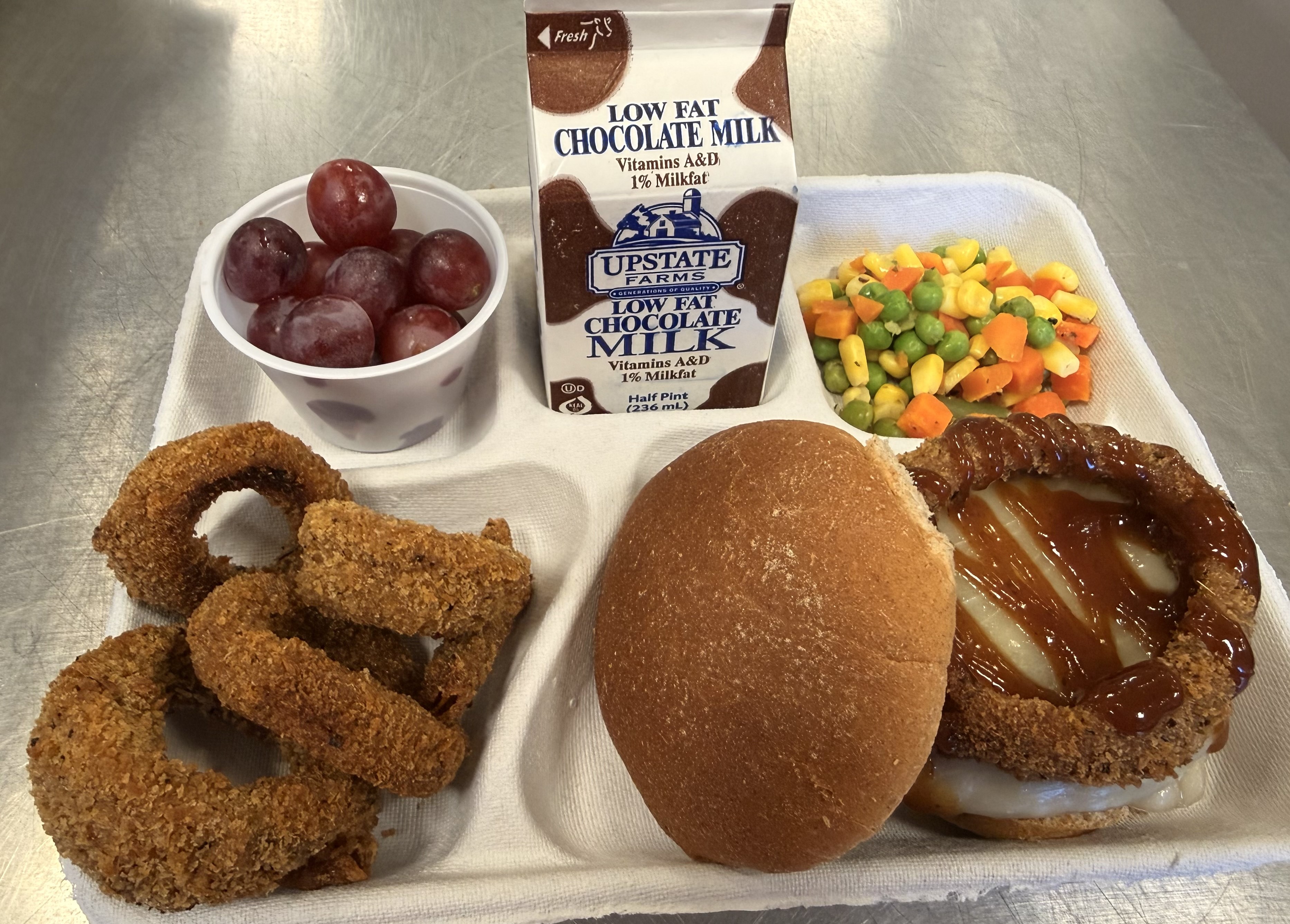 School #21 Rodeo Burger, onion rings, vegetable medley, grapes and chocolate milk