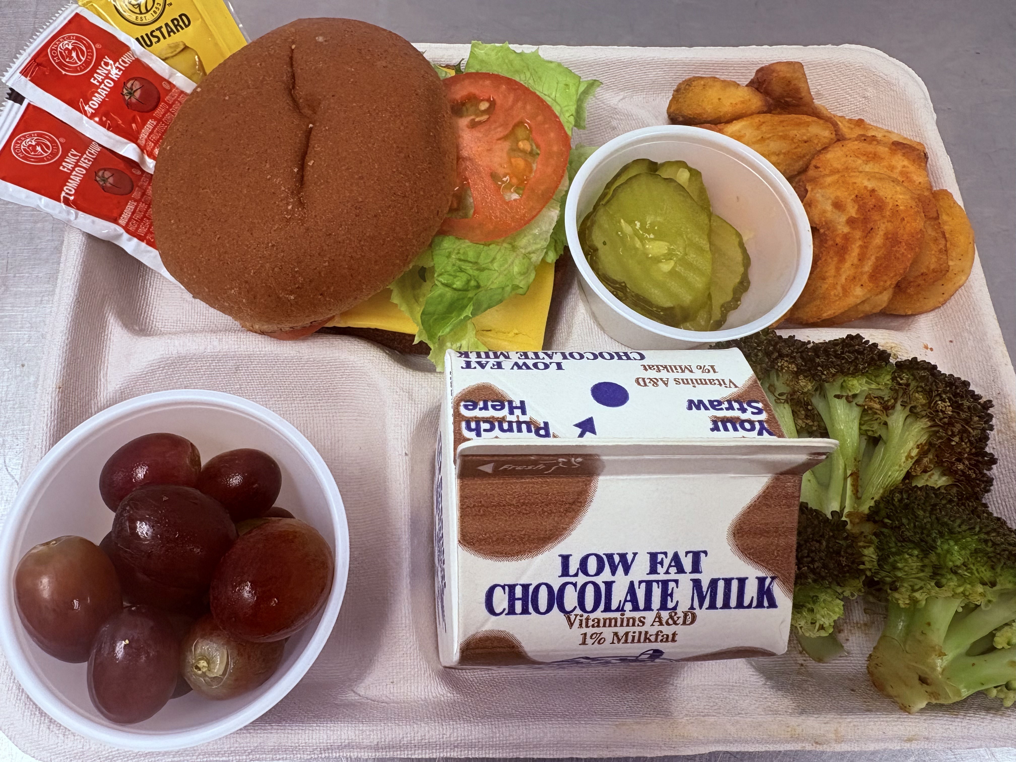 School #24 Rodeo Burger, twisted tators, broccoli, grapes and chocolate milk