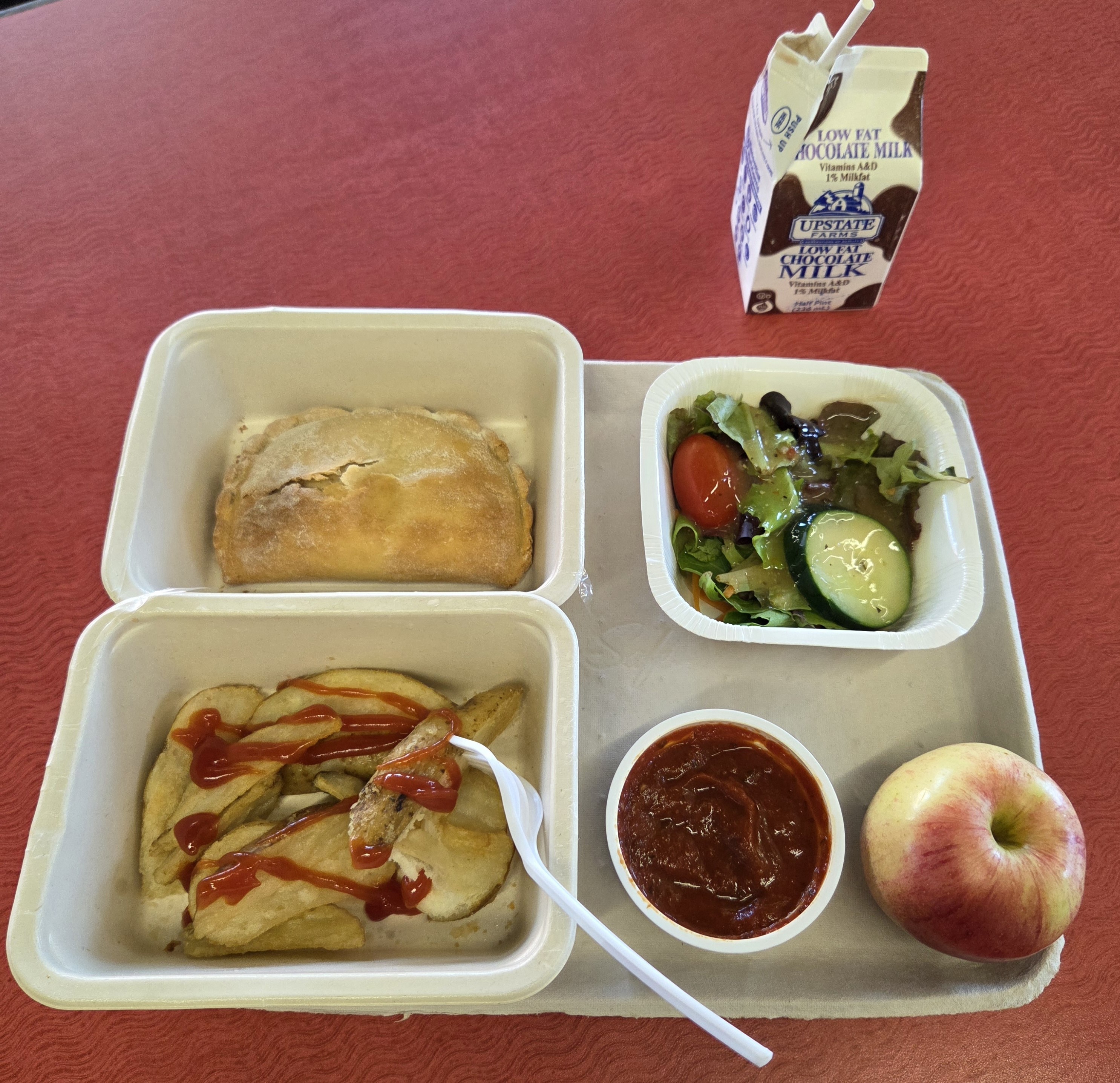 School 65- Prepack lunch served 10.2.25 Cheese Calzone, Rosemary potatoes, Salad, Apple & Chocolate Milk
