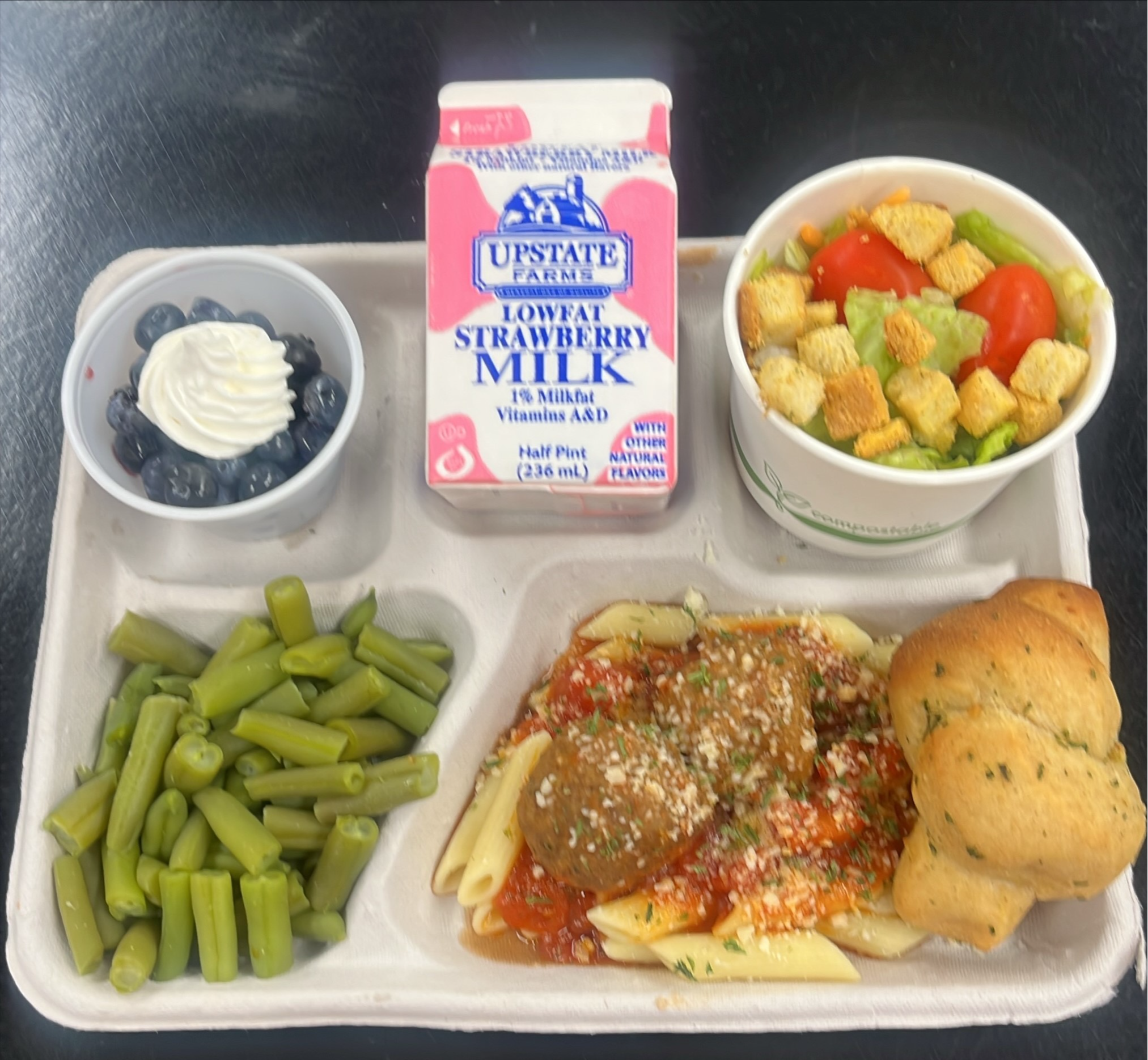 School 95- Lunch served 10.3.2025 Penne pasta with Meatballs & Marinara, Garden salad, Green Beans, Garlic Knots, Blue Berries topped with Whipped Cream & Strawberry Milk