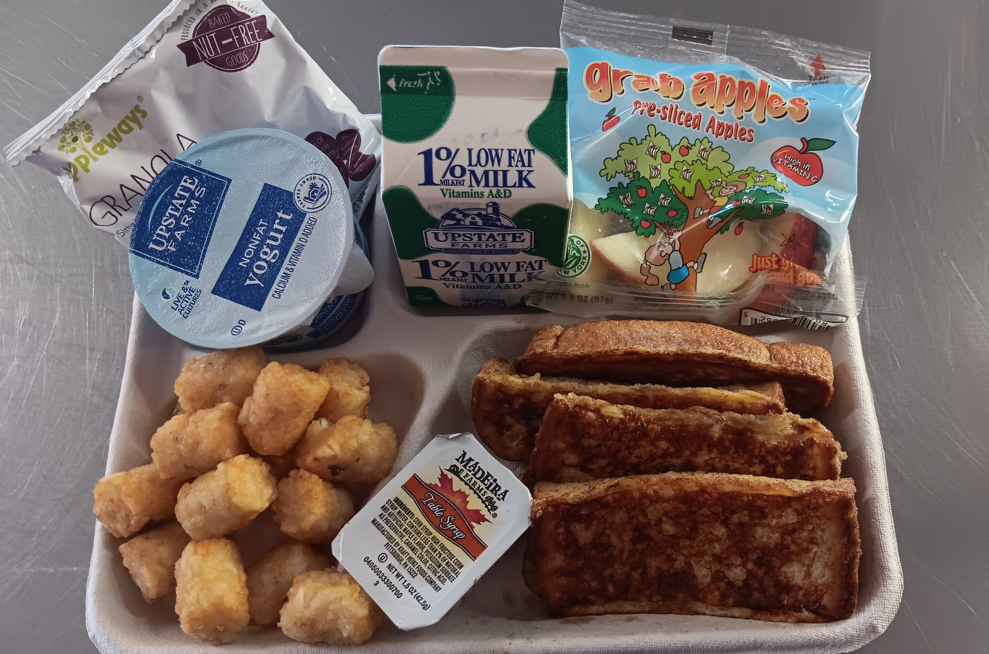 School 156- Lunch served 10.6.2025 French Toast Sticks, Maple Syrup, Tator Tots, Cinnamon Granola Bites, Yogurt, Apple Slices & Milk