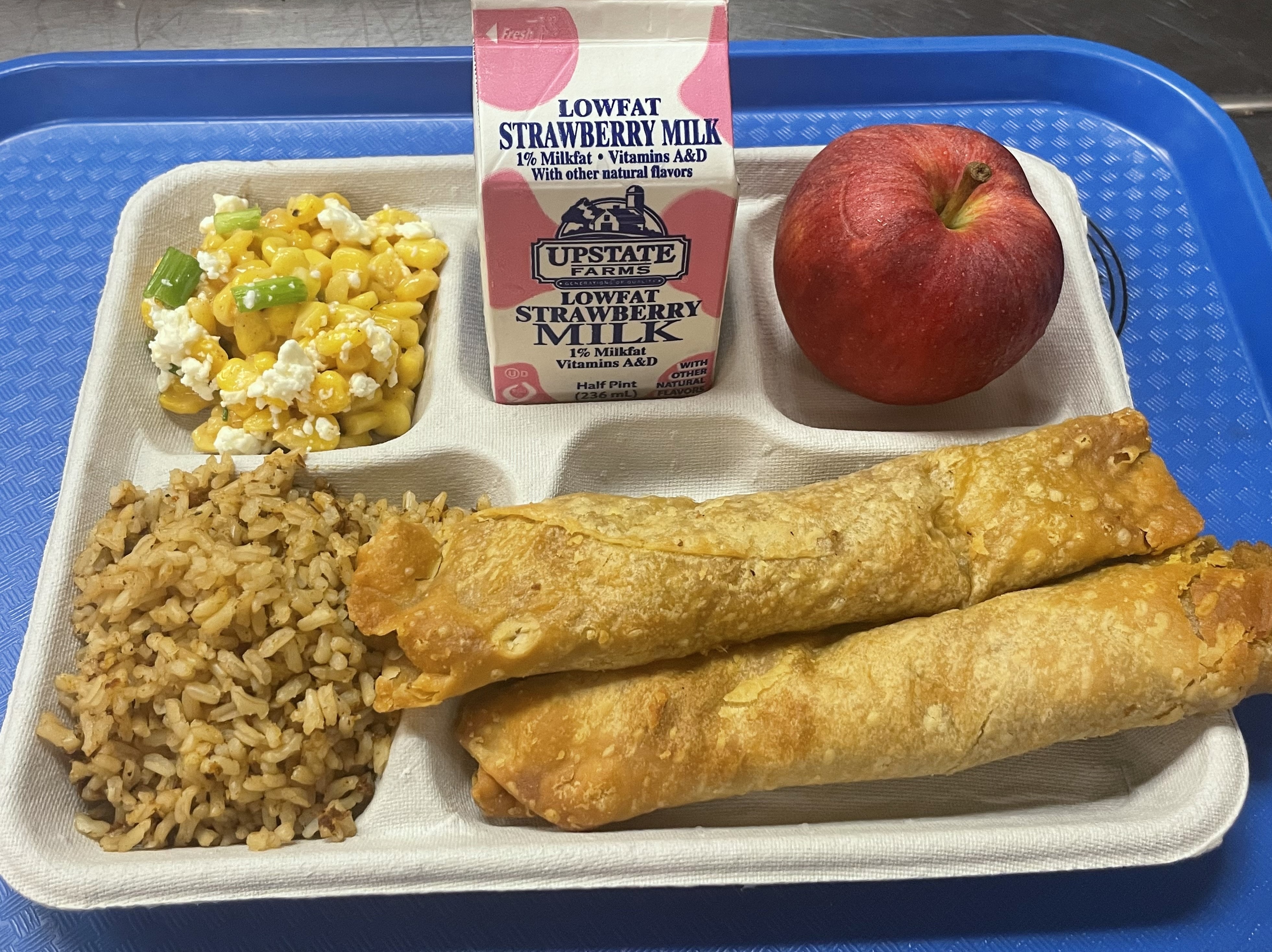 School 19- Lunch served on 10.7.2025 Chicken Crispito, Spanish Rice, Esquites, Salsa, Apple & Strawberry Milk