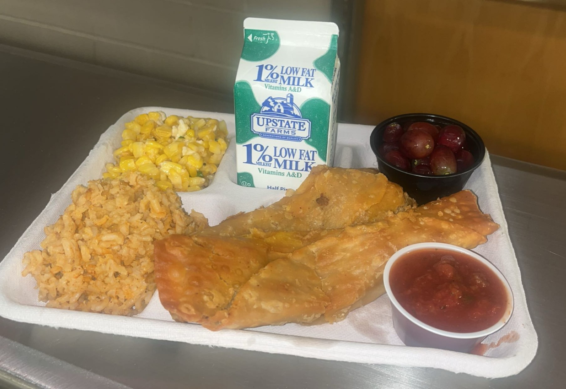 School 30- Lunch served on 10.7.2025 Chicken Crispito, Spanish Rice, Esquites, Salsa, Grapes & Milk