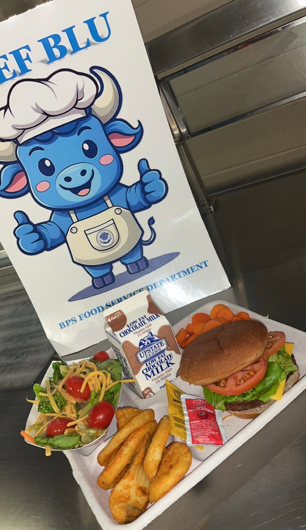 School 30- Lunch served on 10.8.25 Cheeseburger, Twister Taters, Carrot Coins, Garden Salad & Chocolate Milk