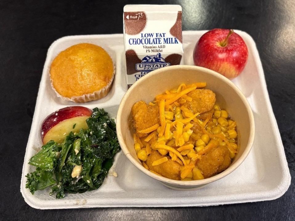 School 72 -Lunch served on 10.10.25 Popcorn Chicken, Mashed Potatoes, Sweet Corn, Corn Muffin, NY Kale Salad, Apple & Chocolate Milk