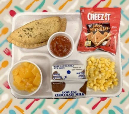 School 50- Prepack Lunch served on 10.15.25 Empanada, Cheez it, Corn, Peaches & Chocolate milk