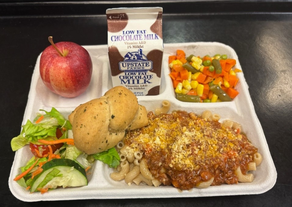School 72- Lunch served on 10.16.25 Beef Bolognese Pasta & Spagetti Sauce, Parmesan Cheese, Vegetable Medley, Garlic Knot, Garden Salad, Apple & Chocolate milk
