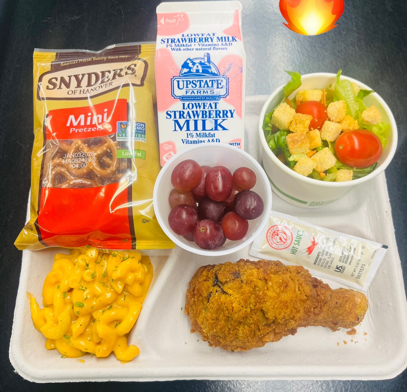 School 95- Lunch served on 10.23.25 Breaded Chicken Drumstick, Macaroni & Cheese, Garden Salad, Pretzels, Grapes & Strawberry Milk